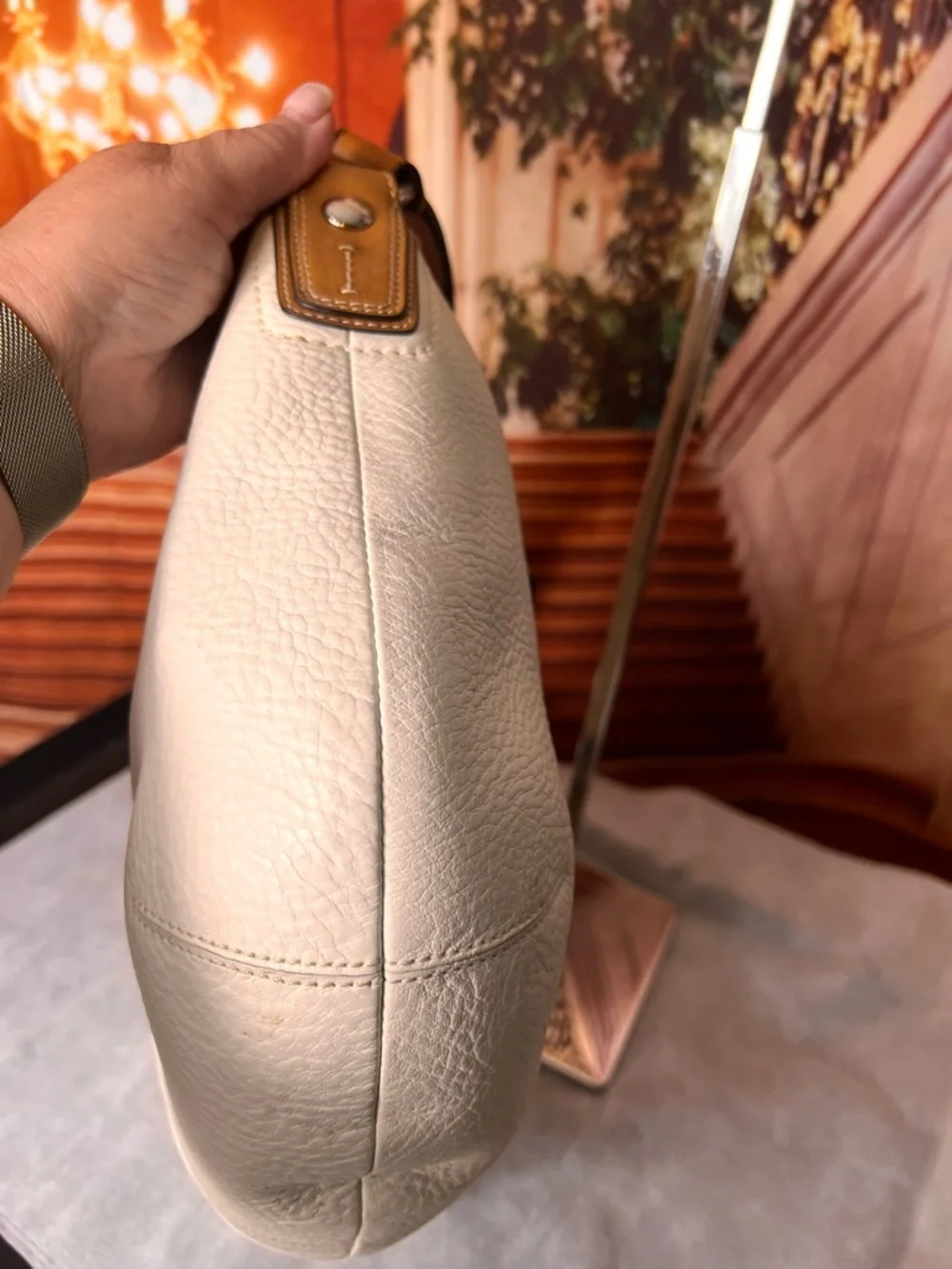 Coach Soho White Pebbled Leather Hobo bag features a distinctive braided handle